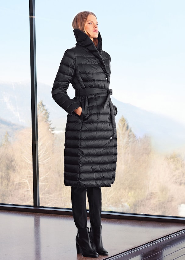 Long quilted coat with warm down/feather filling.