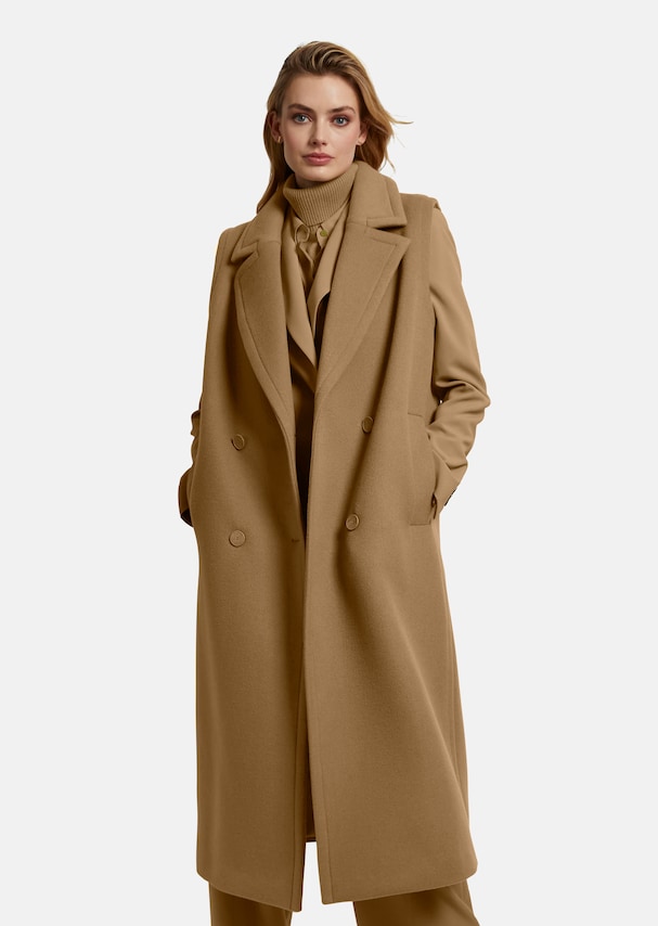 Sleeveless long waistcoat in a coat look