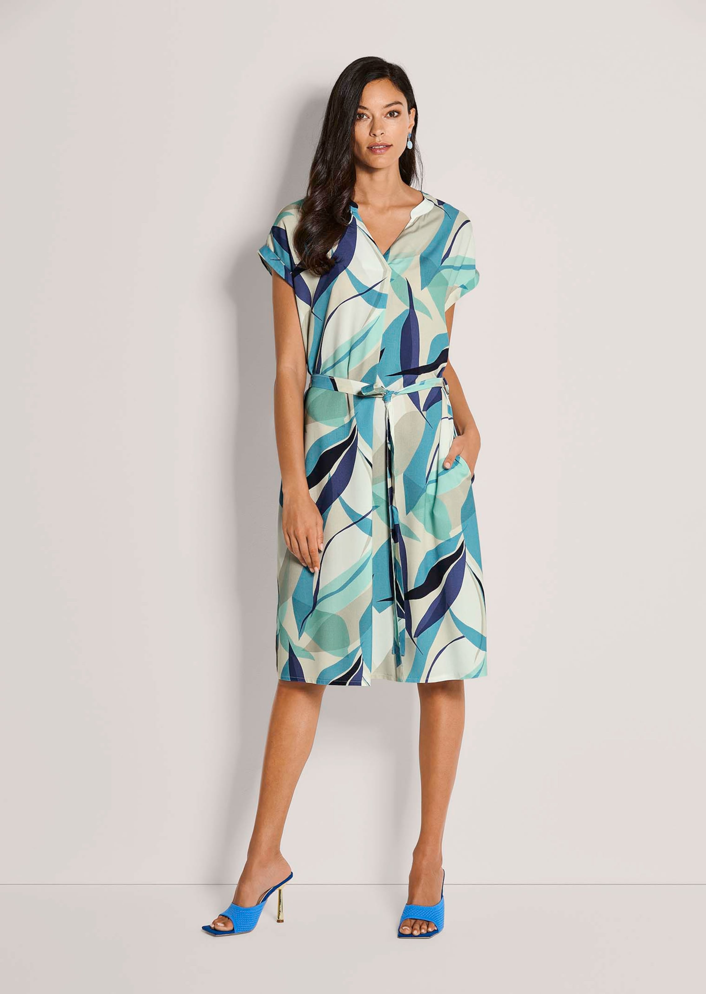 Summer dress with a graphic print and tie belt