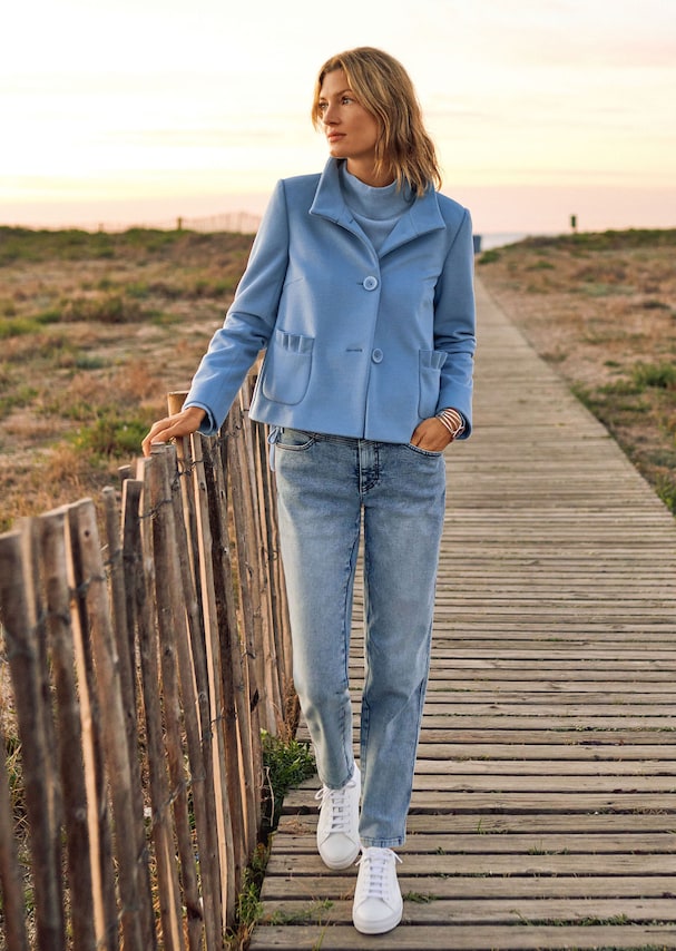 Short blazer with minimal structure and ruffle detail