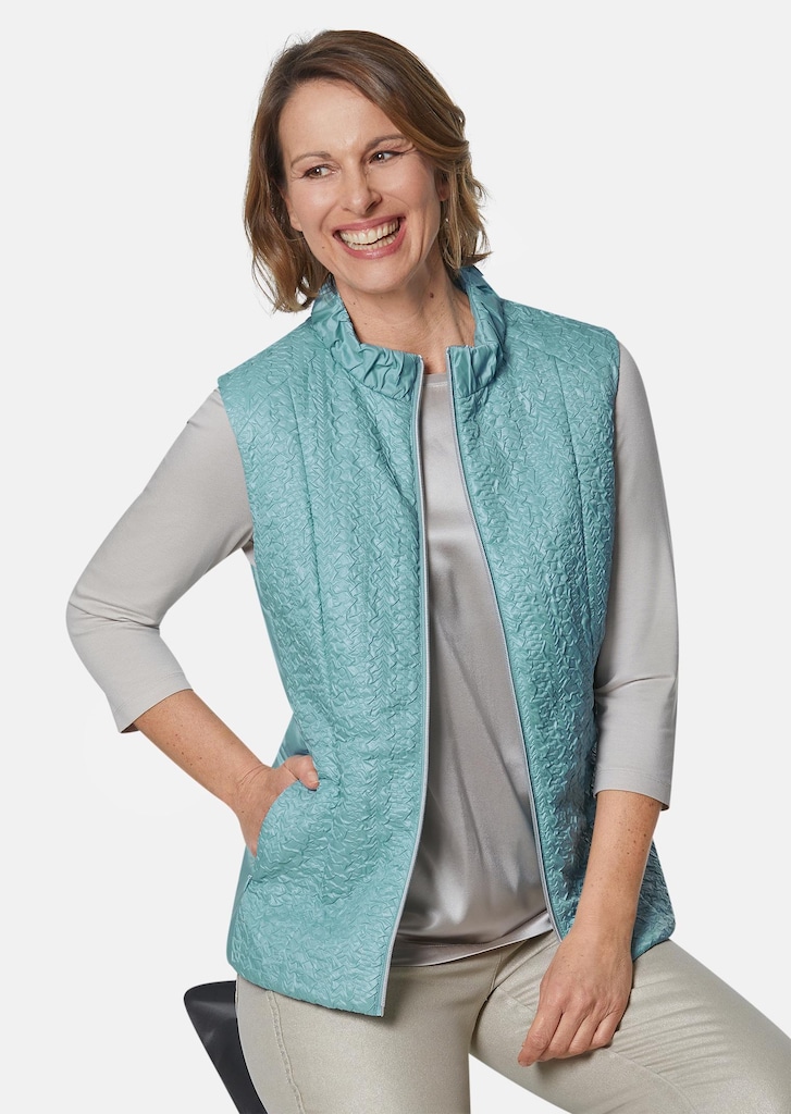 Licht vest met mooie plooien