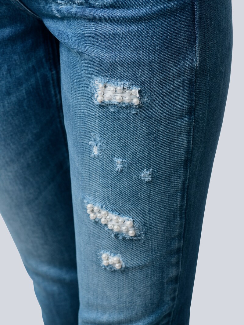 Jeans mit destroyed Effekten