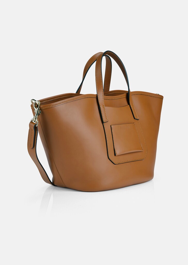 Leather bag in trapezoid shape
