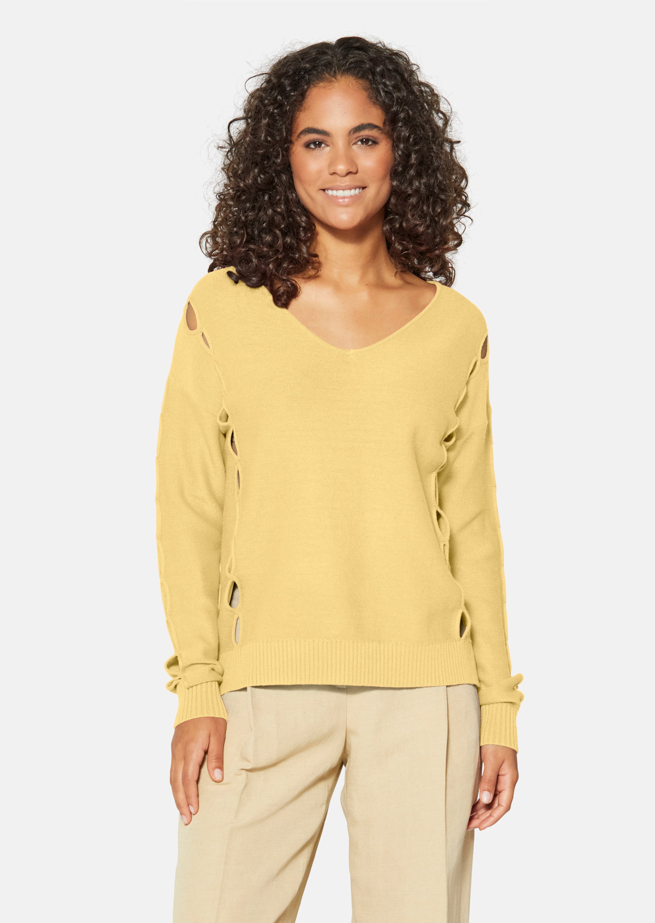 Knitted jumper with cut-outs and V-neckline