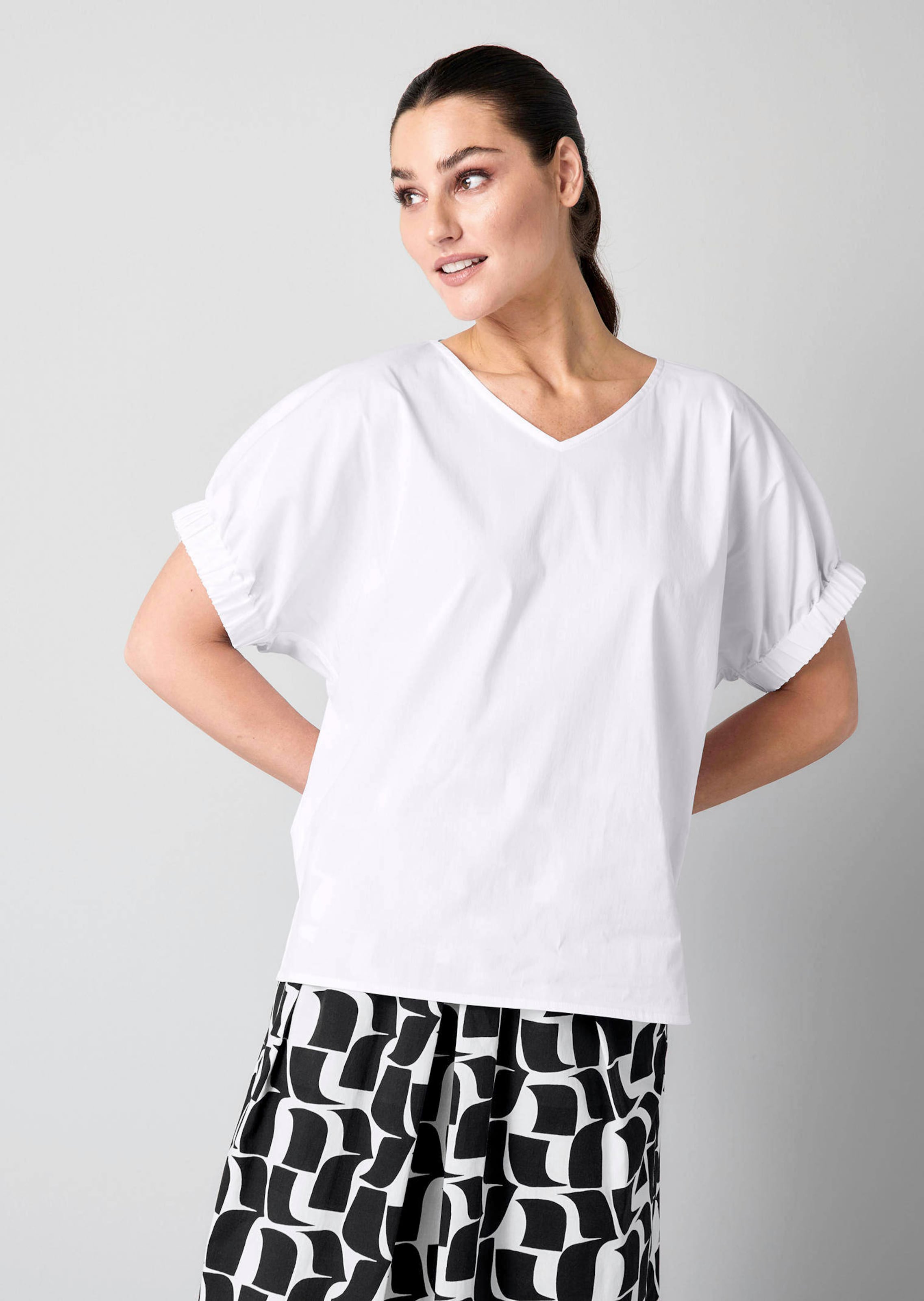 Bluse mit breitem Bündchen am Ärmel