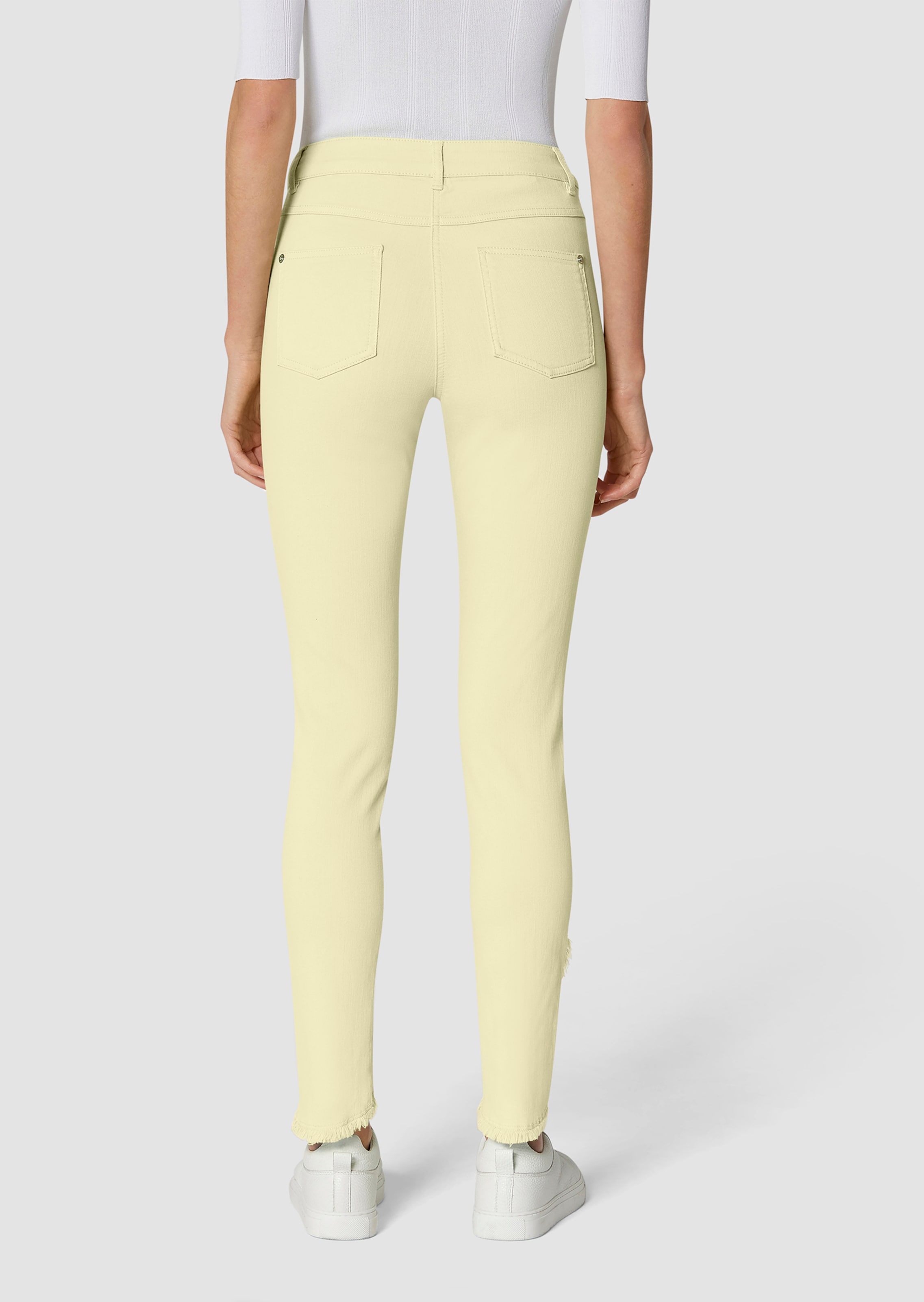 Slim jeans with fringed hem in butter yellow MADELEINE Fashion