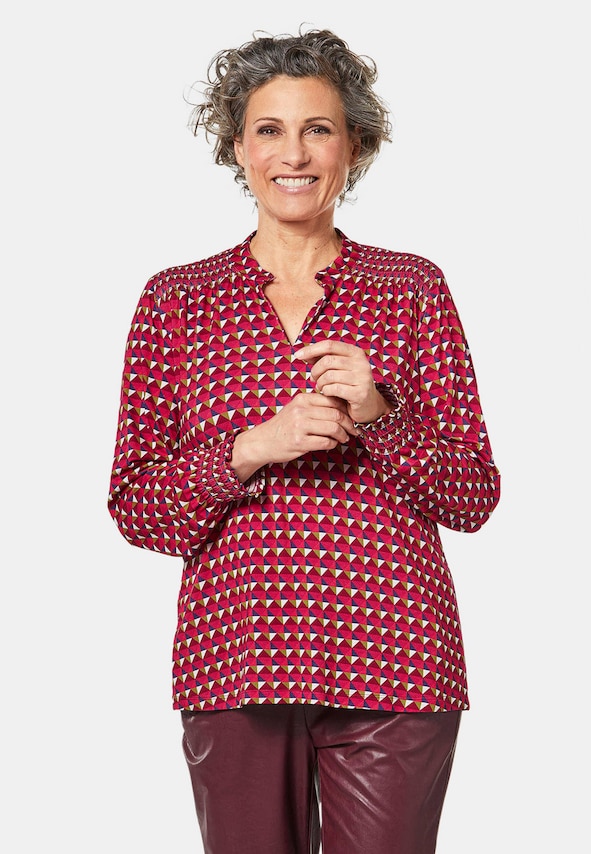 Jersey blouse met modieuze smokwerkdetails