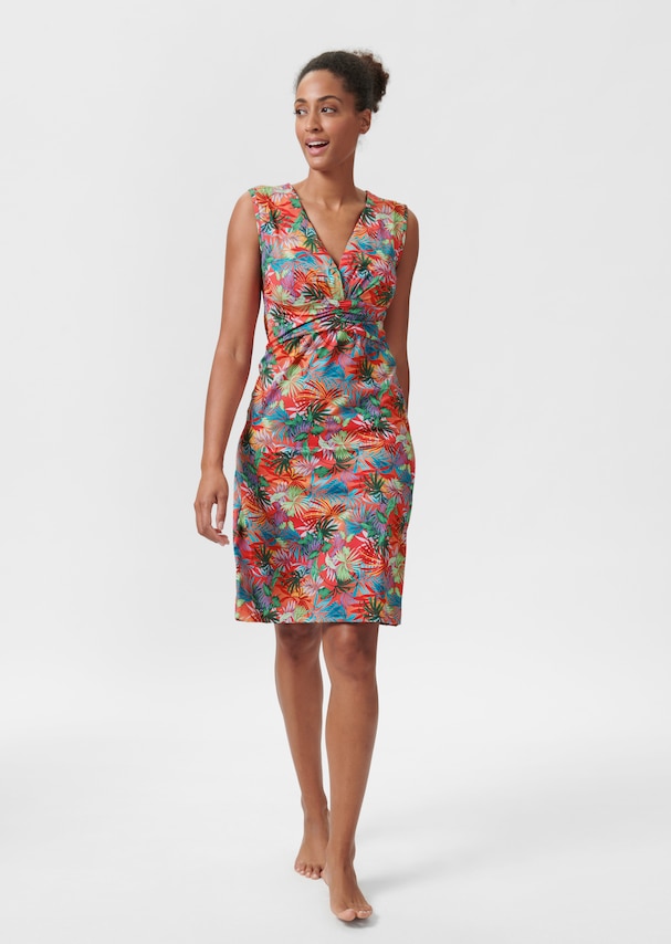 Sleeveless beach dress with tropical print and gathered effect 1