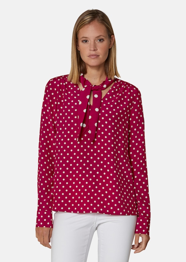 Flared blouse in a fashionable polka dot pattern