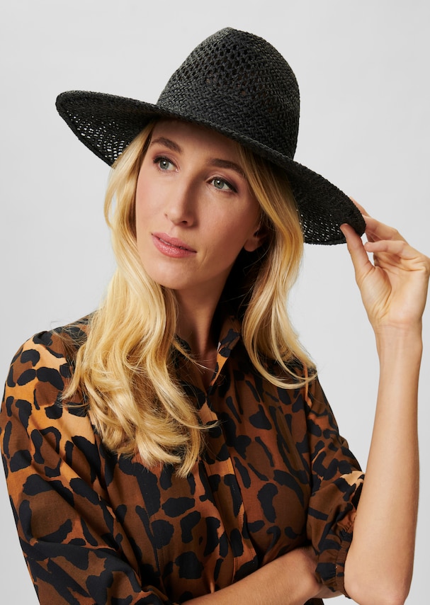 Straw hat with perforated pattern
