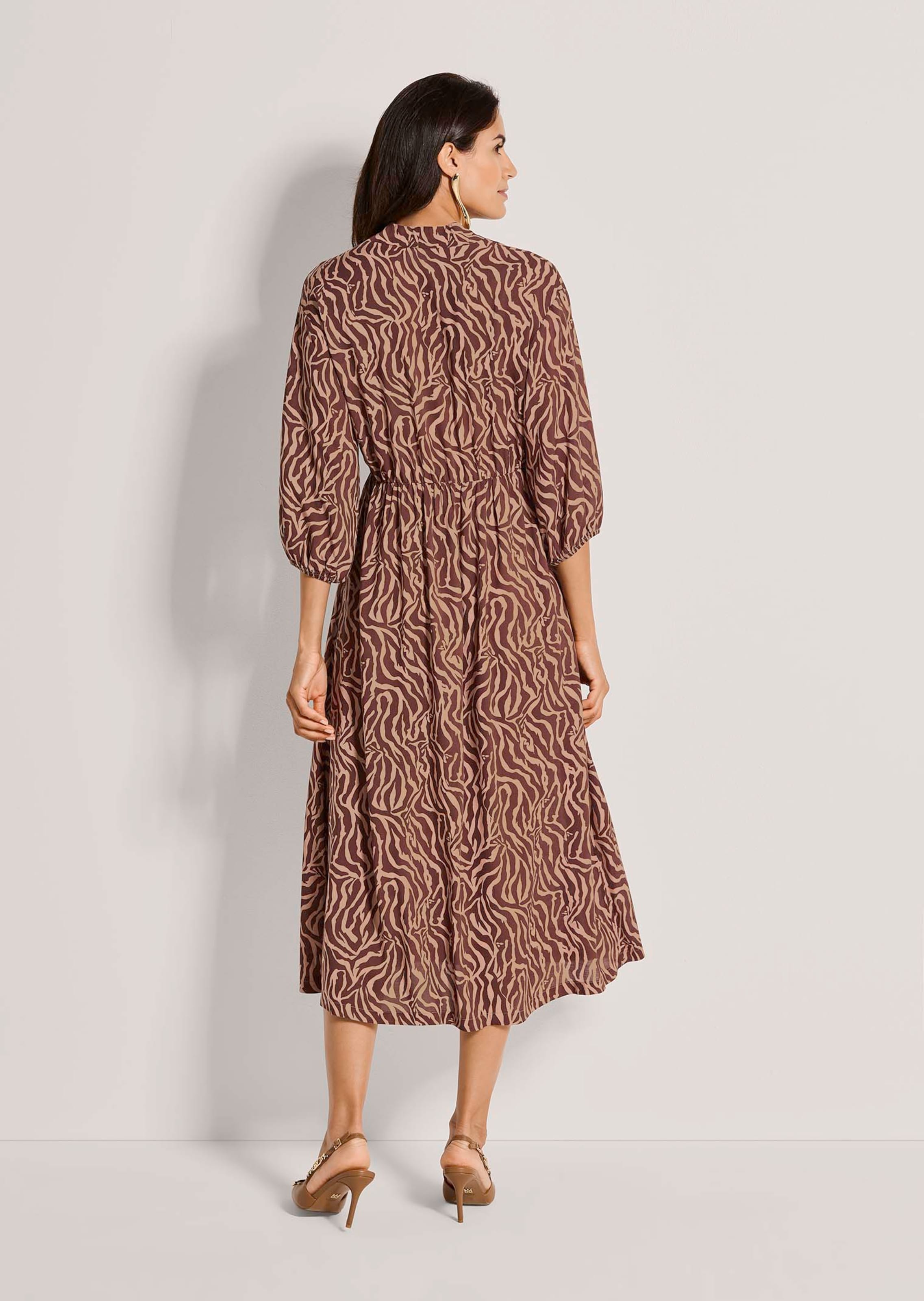 Zebra-print wrap-style dress in black / chestnut