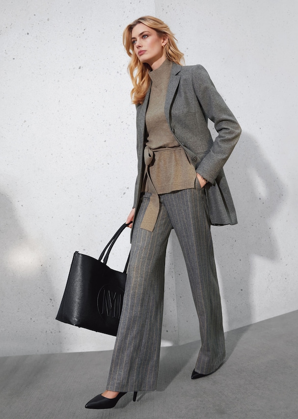 Wide pinstripe trousers with a herringbone texture