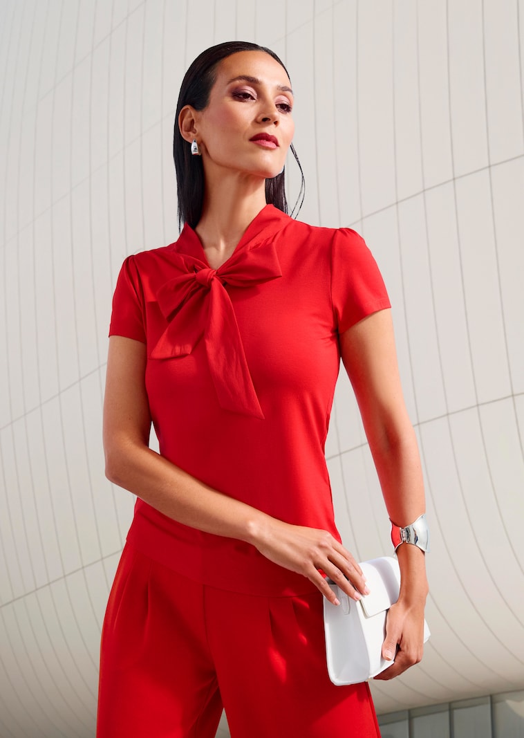 Elegant top with a ruffle