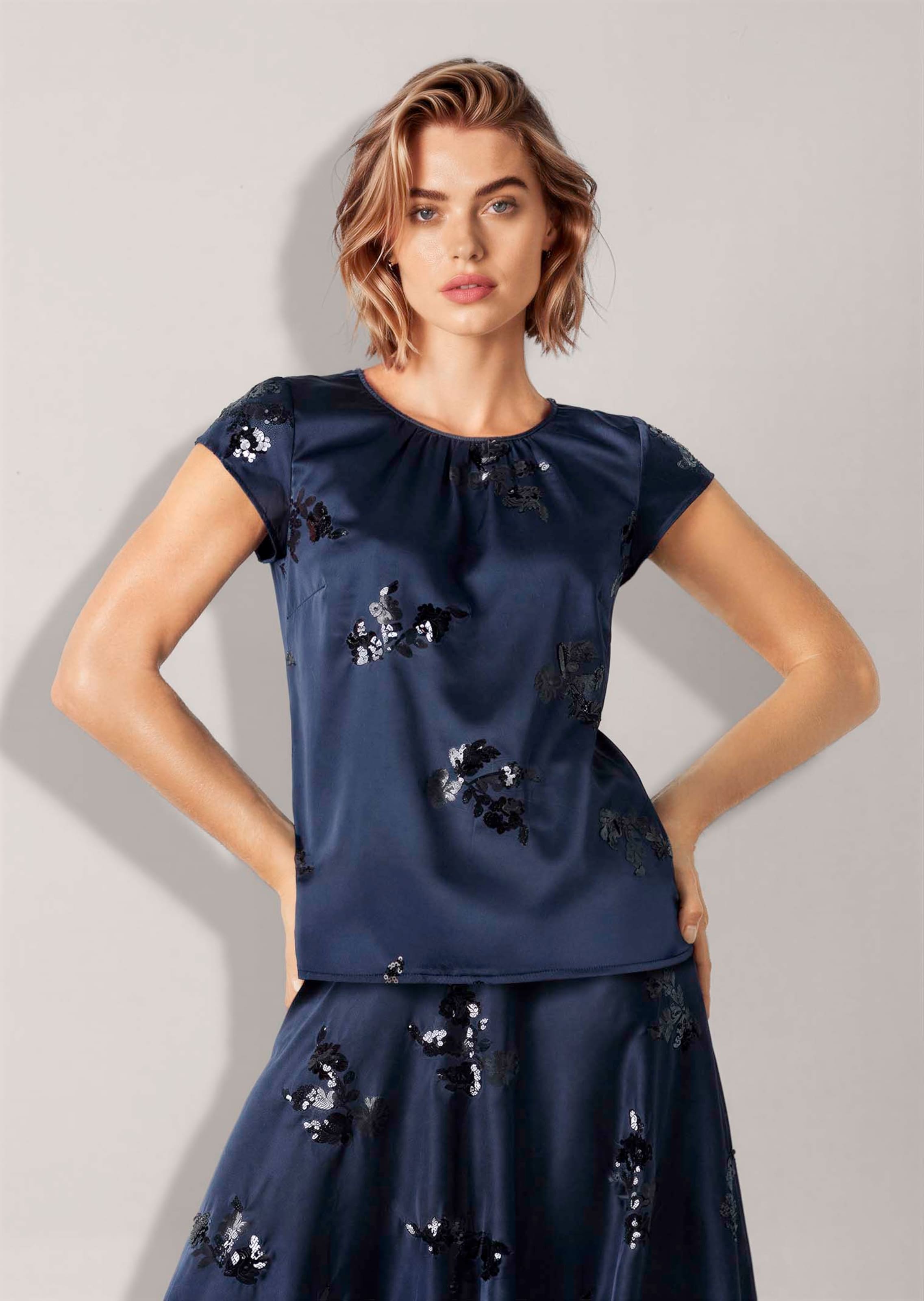 Satin blouse featuring sequinned motifs
