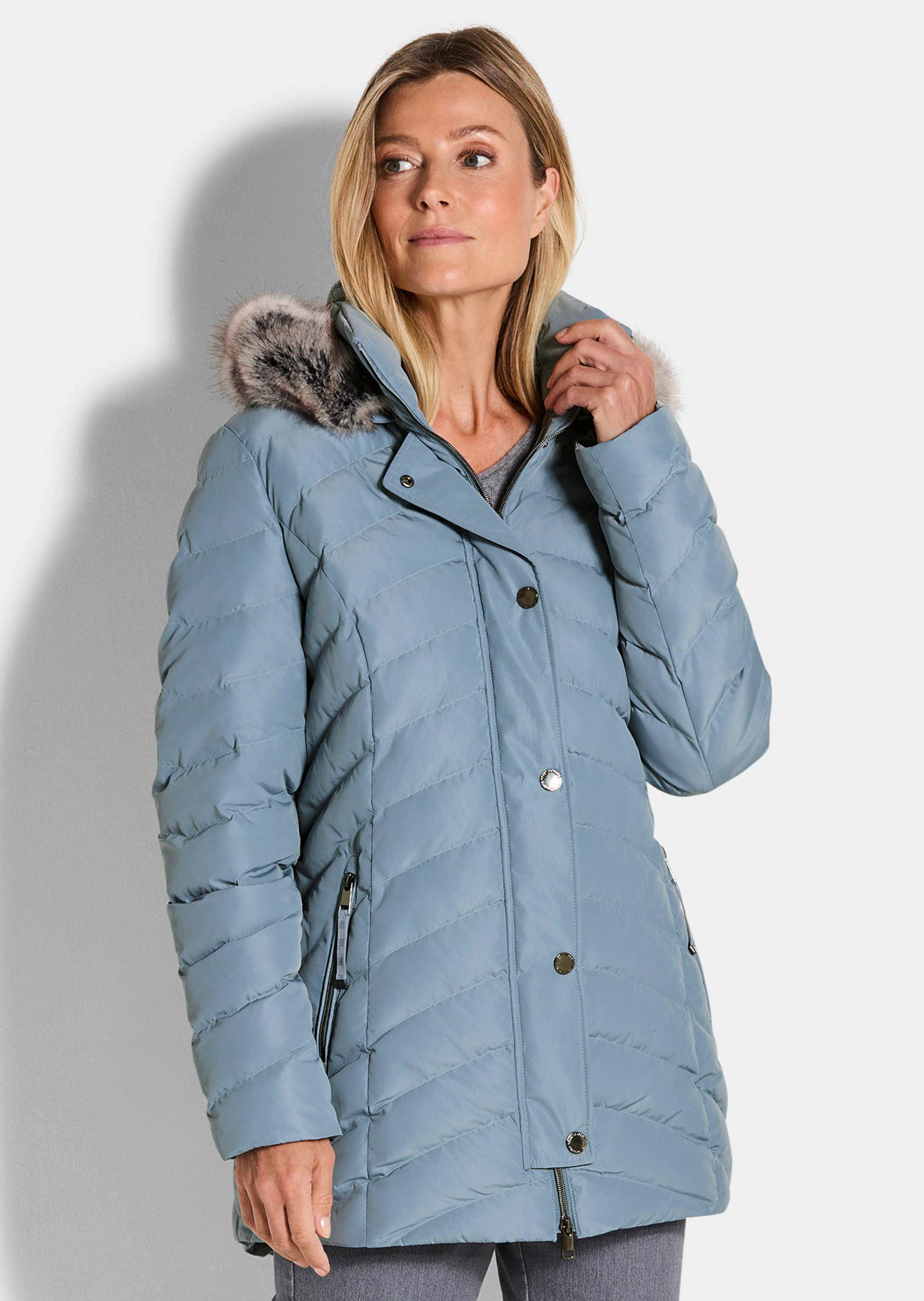 Veste matelassée avec capuche en fausse fourrure