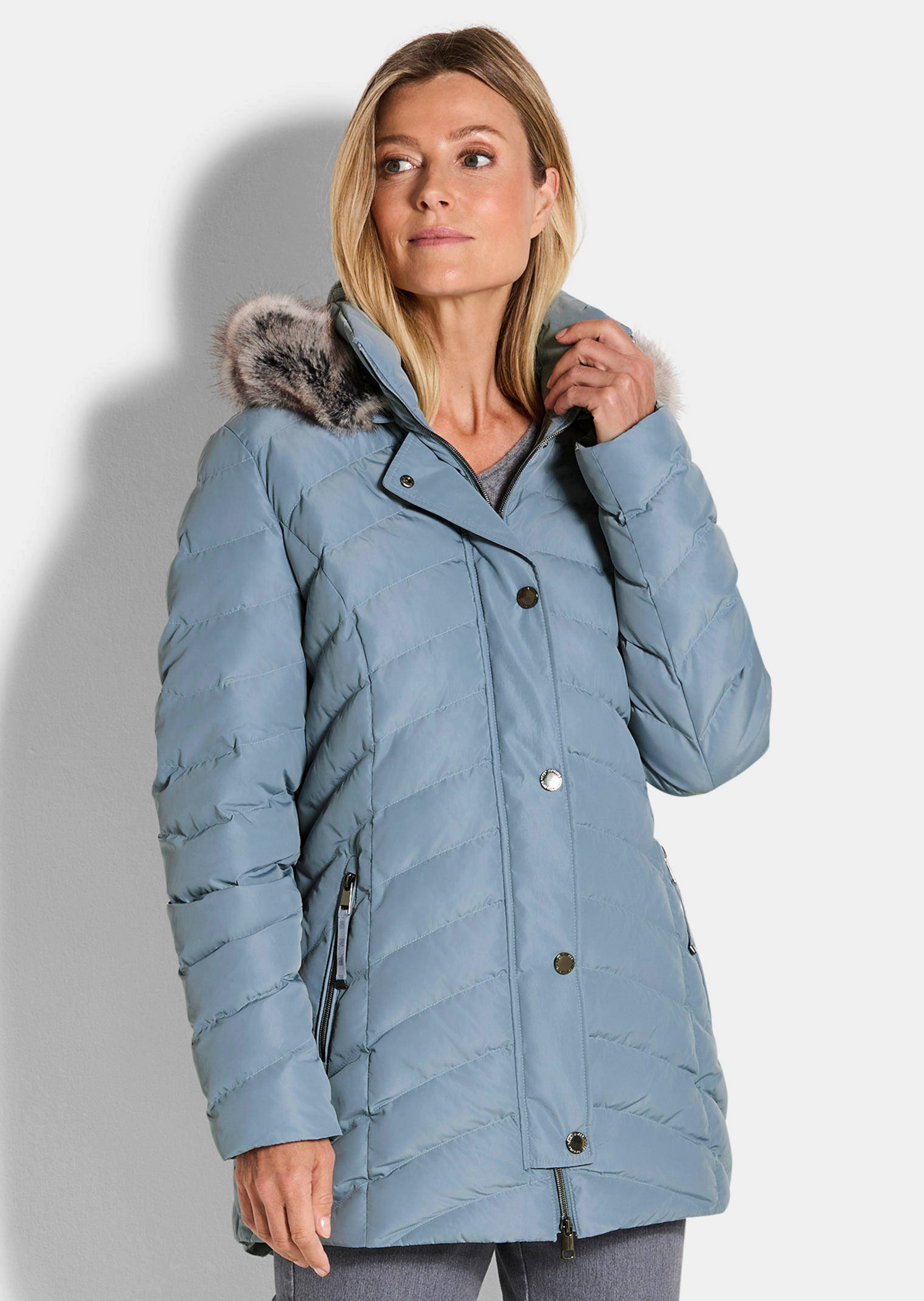 Veste matelassée avec capuche en fausse fourrure