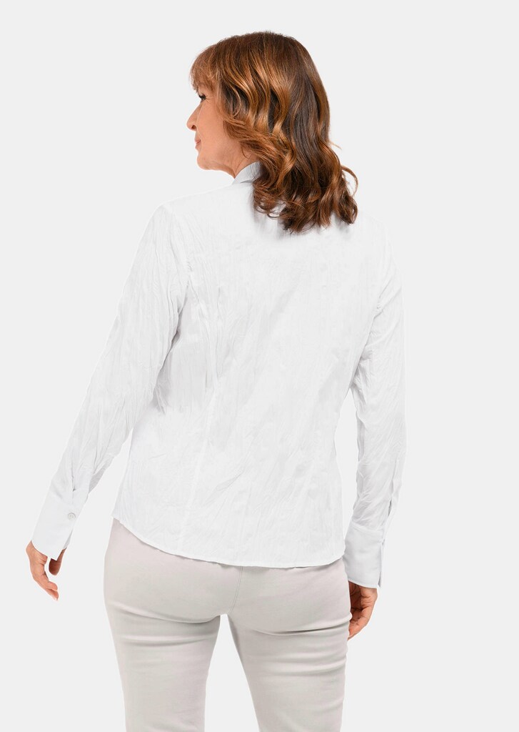 Besonders elegante Crashbluse mit detailreicher Verarbeitung