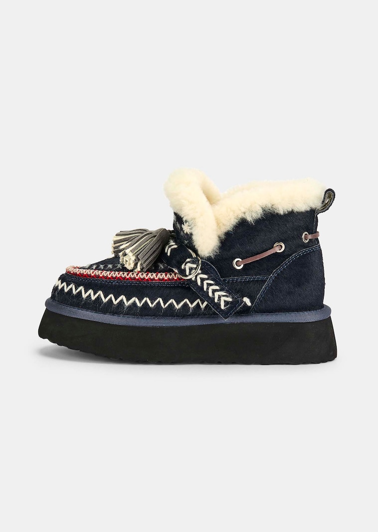Knusse boots met boho-borduursel