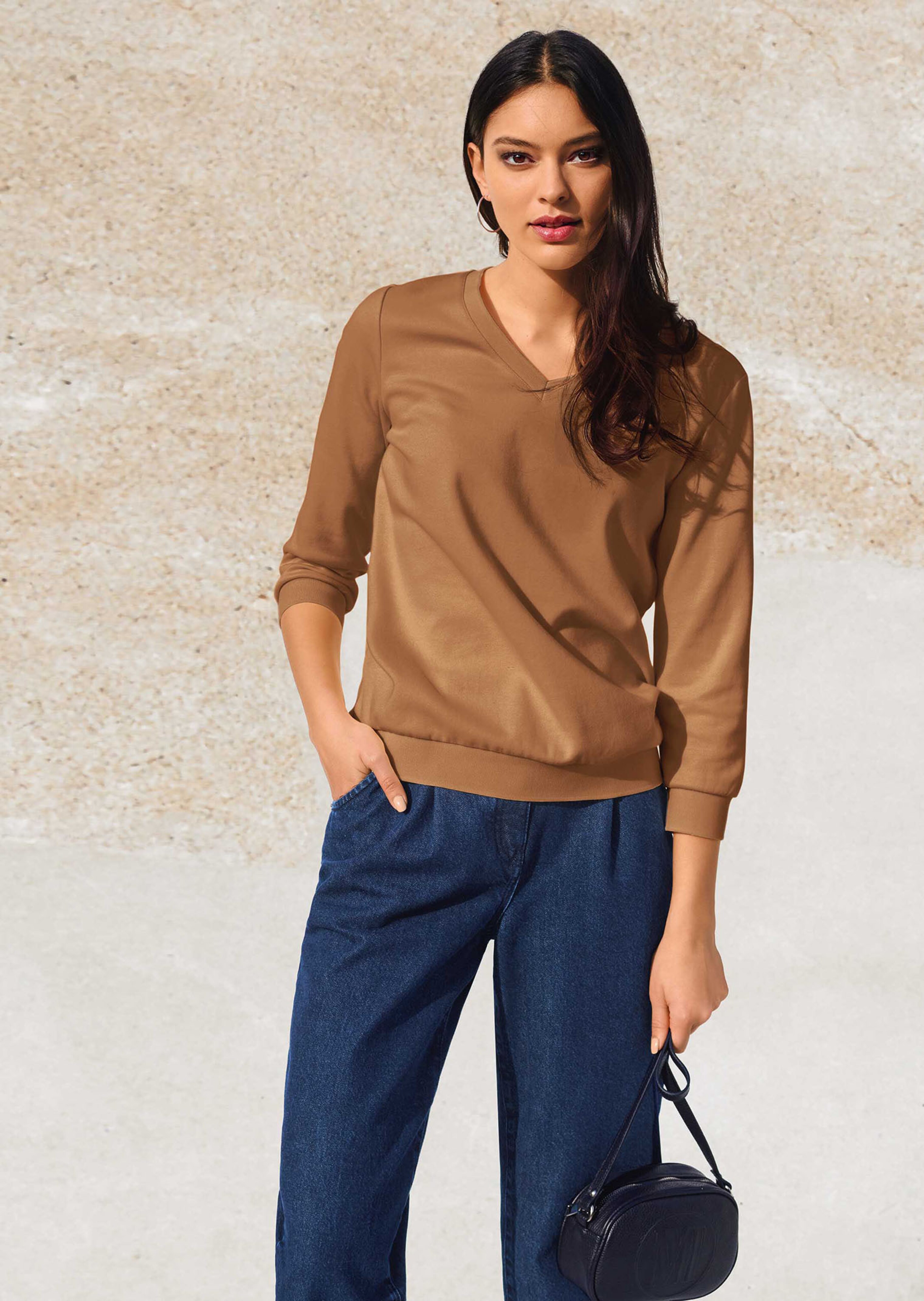 Sweatshirt mit 3/4-langen Ärmeln.