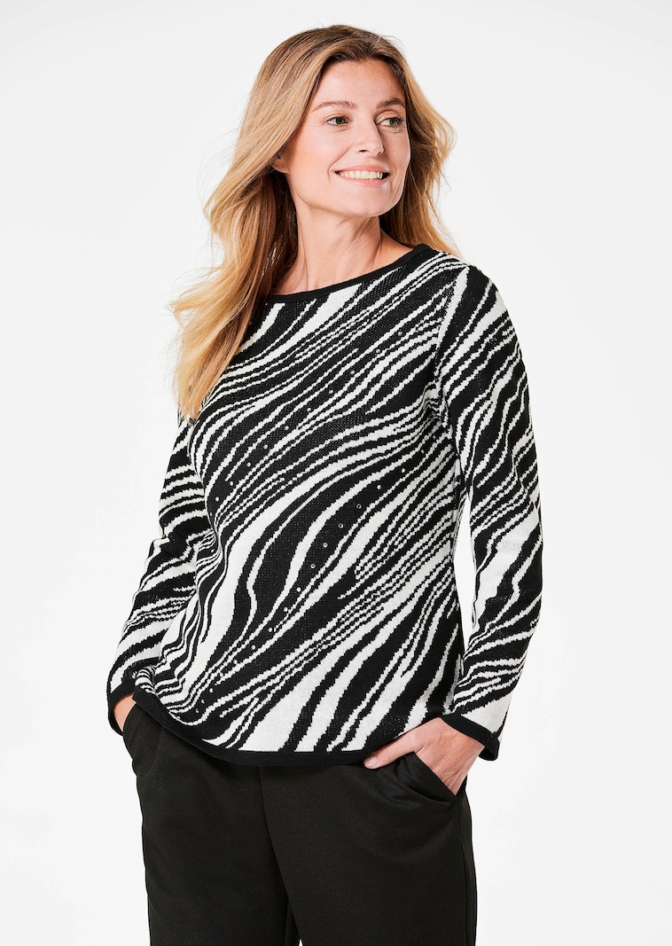 Ausdrucksstarker Pullover mit handverarbeiteten Glitzersteinen