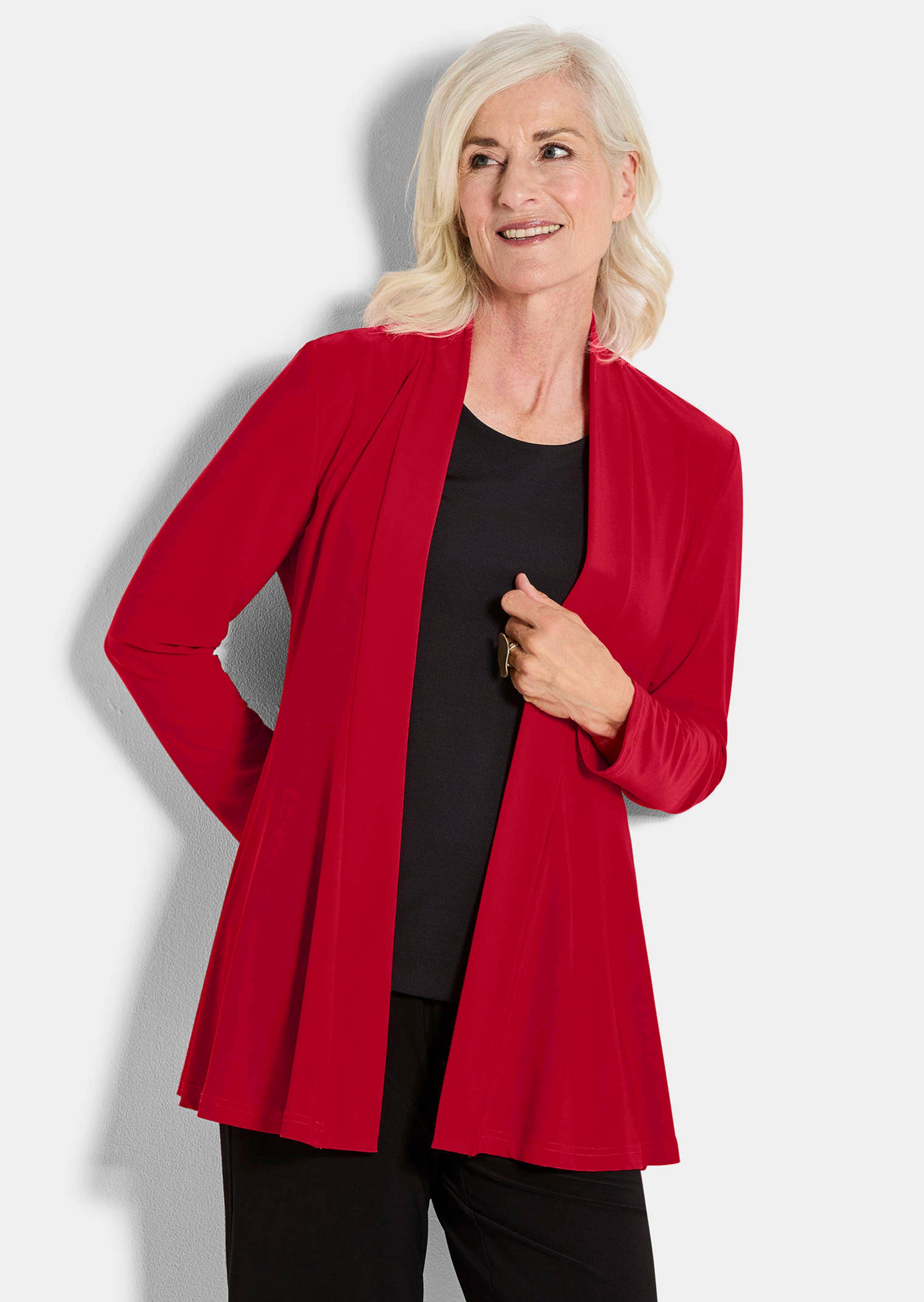 Pehmeästi laskeutuva pitkä jerseyjakku