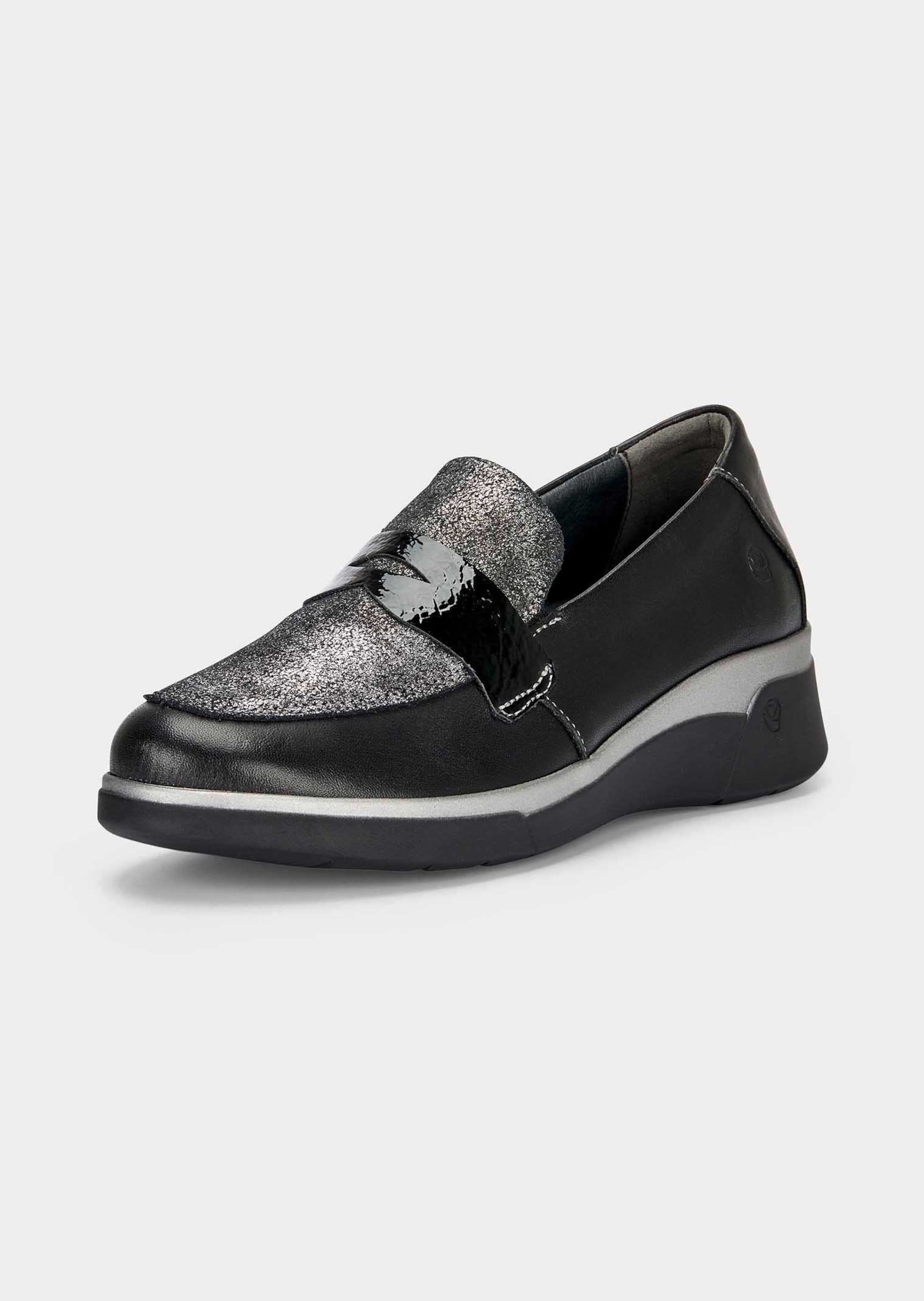 Glinsterende schoenen met lakaccenten