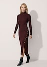 Figure-hugging knitted dress with decorative buttons and slit thumbnail 1