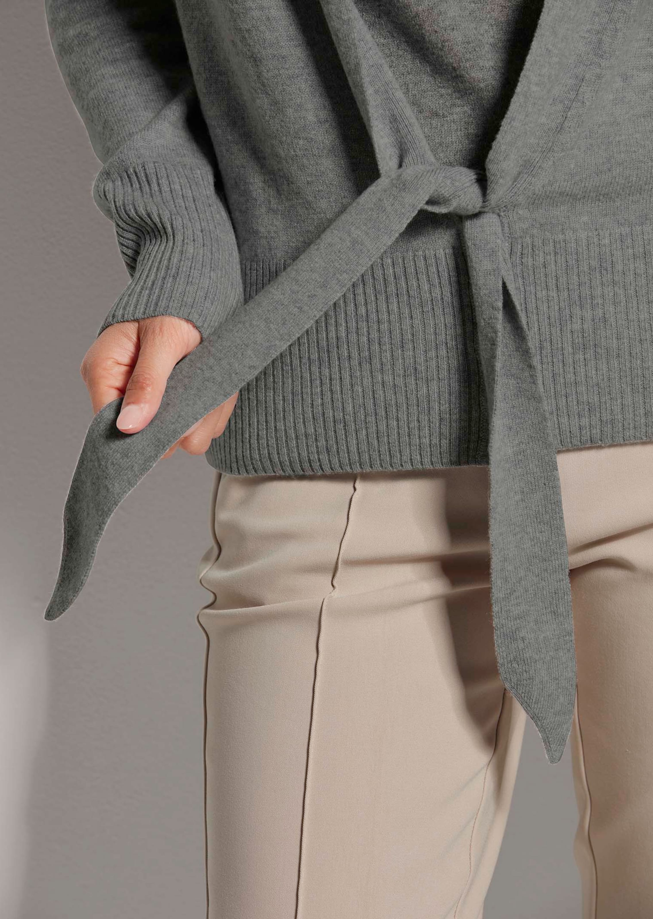 Cashmere cardigan with deep V-neck and tie ribbon in stone grey