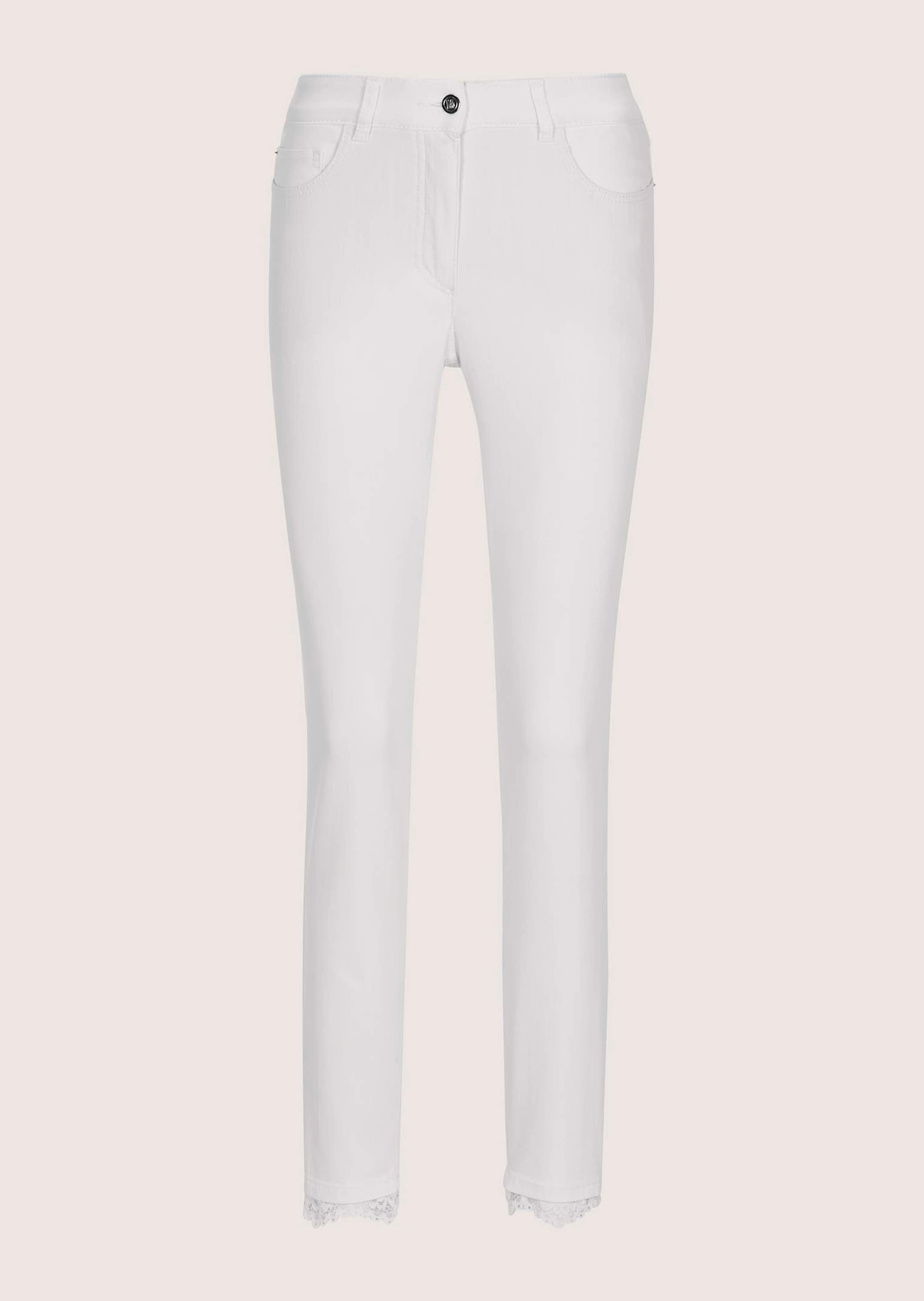 Slim-fit jeans with lace hem detail