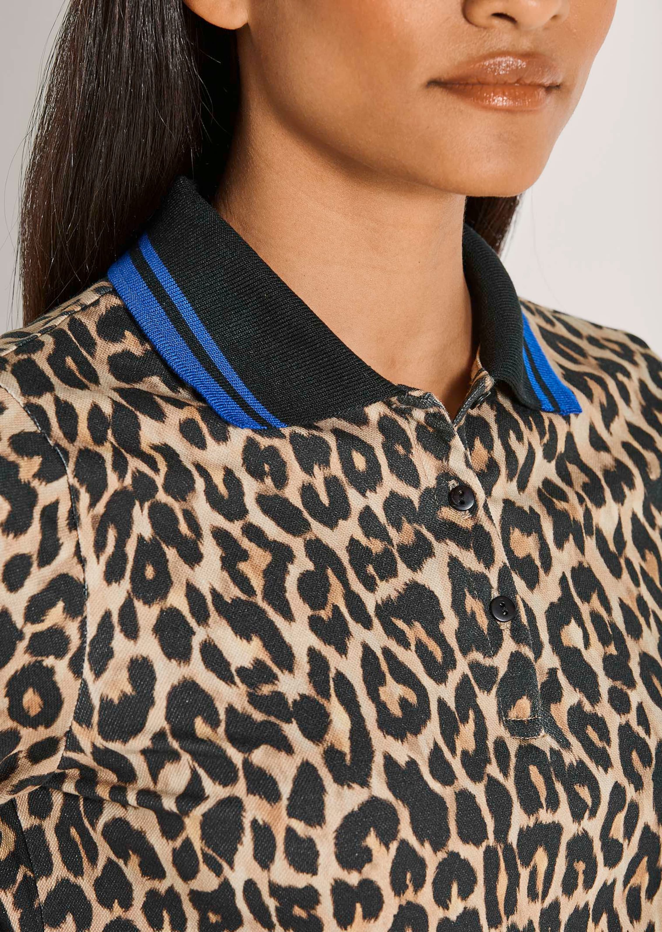 Leopard print polo shirt in black / caramel / royal blue