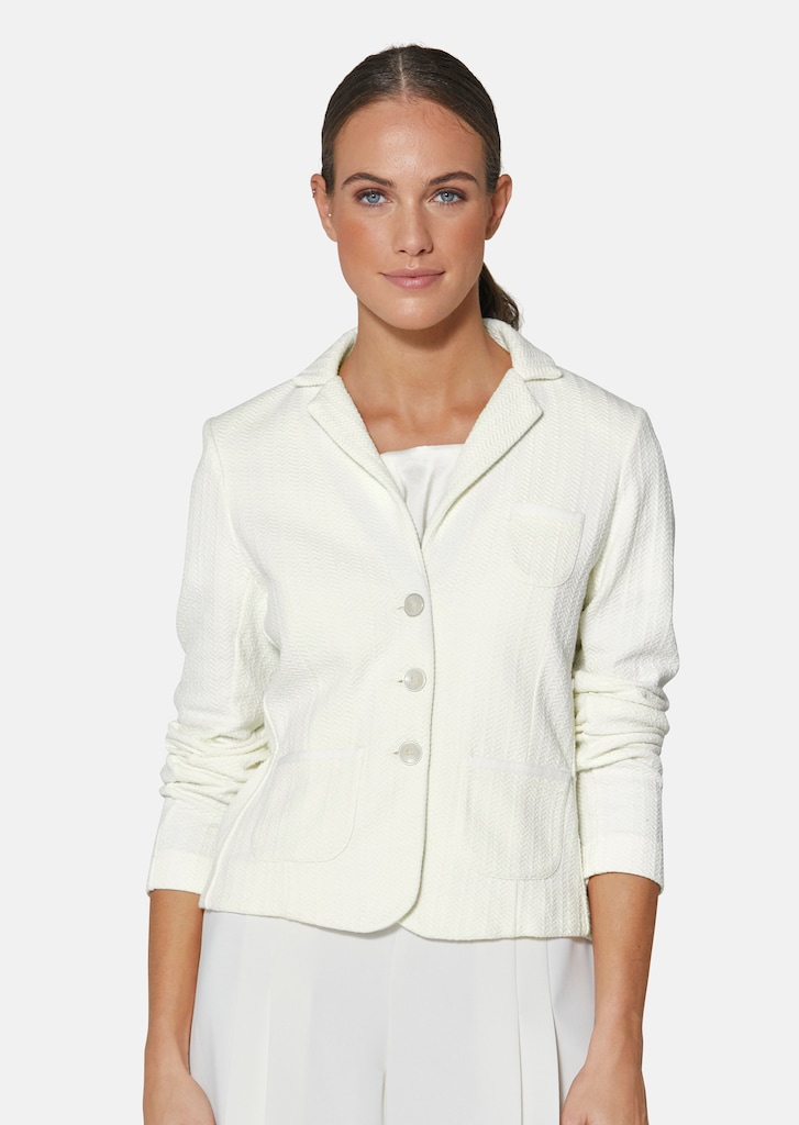 Trendy short-cut blazer in jersey with structured sections