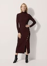 Figure-hugging knitted dress with decorative buttons and slit thumbnail 2